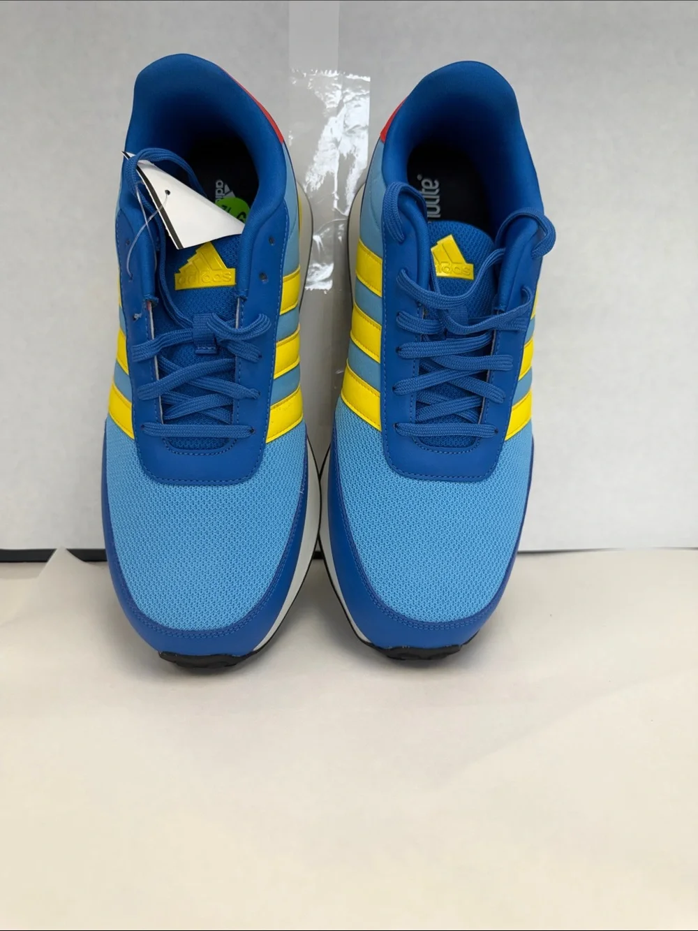 adidas Men's Blue Sneakers with Yellow Stripes and Red Heel Accent